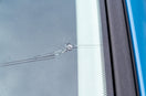 A chipped car windscreen being repaired with the focus on whether windscreen repairs are covered by insurance.