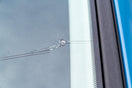 A chipped car windscreen being repaired with the focus on whether windscreen repairs are covered by insurance.