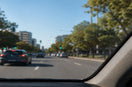 Car with a cracked windscreen driving on an Australian road.